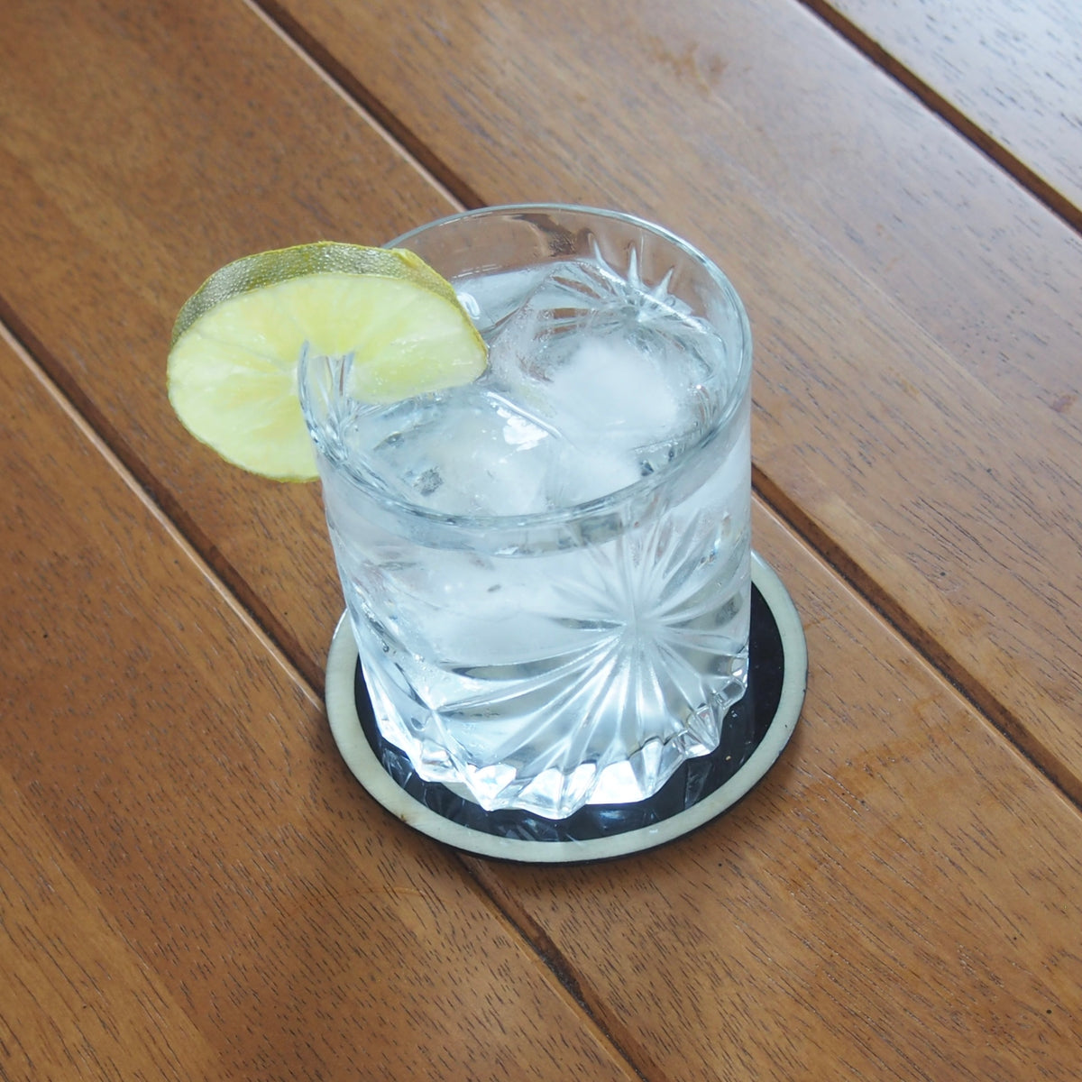 Sous-verre rond géométrie sacrée Om — Bois et résine époxy