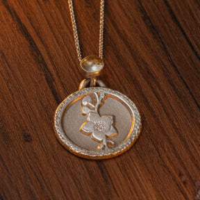 Fossil Ammonite & Engraved Wolf Sterling Silver Necklace
