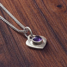 Fossil Ammonite & Engraved Wolf Sterling Silver Necklace
