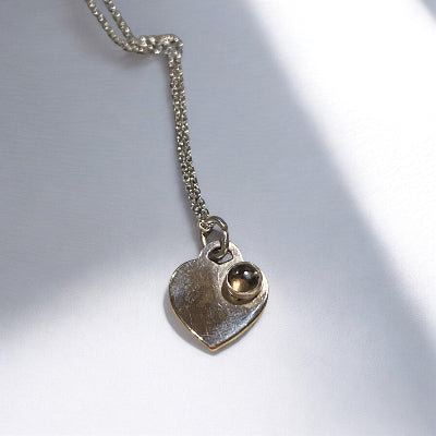 Fossil Ammonite & Engraved Wolf Sterling Silver Necklace
